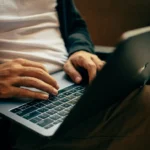 Person typing on a laptop