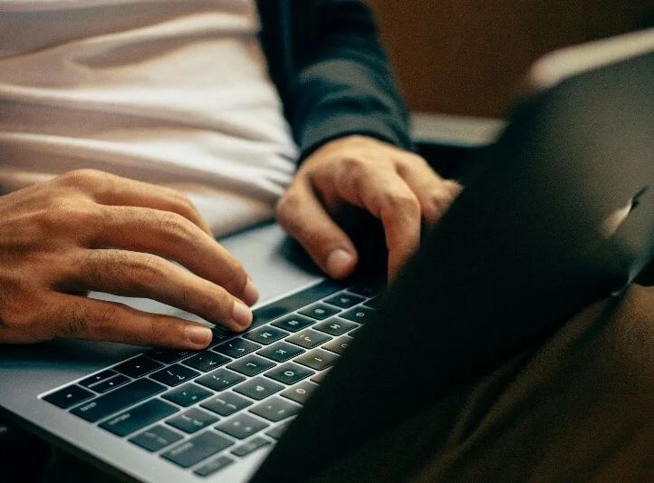 Person typing on a laptop